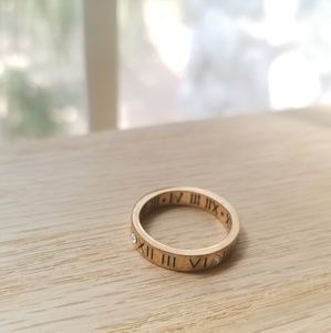 Diamond Rose Gold Roman Numerals Ring